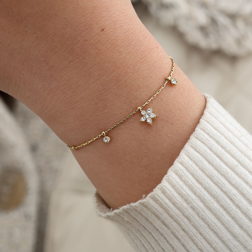Edelstahlarmband in gold mit Blumenanhänger und Zirkon-Steinen, 17+3cm lang.