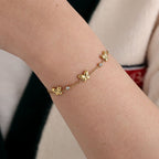 Edelstahlarmband in gold mit drei Schmetterlingen und Zirkon-Steinen, 17+3cm lang.