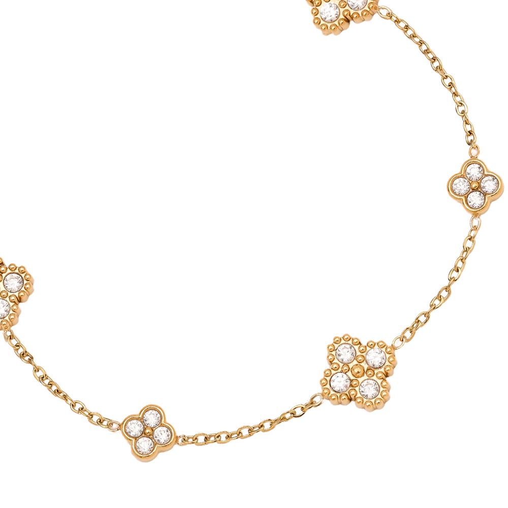 Goldenes Armband mit kleinen blütenförmigen, zirkonia-besetzten Elementen – 14K vergoldet.