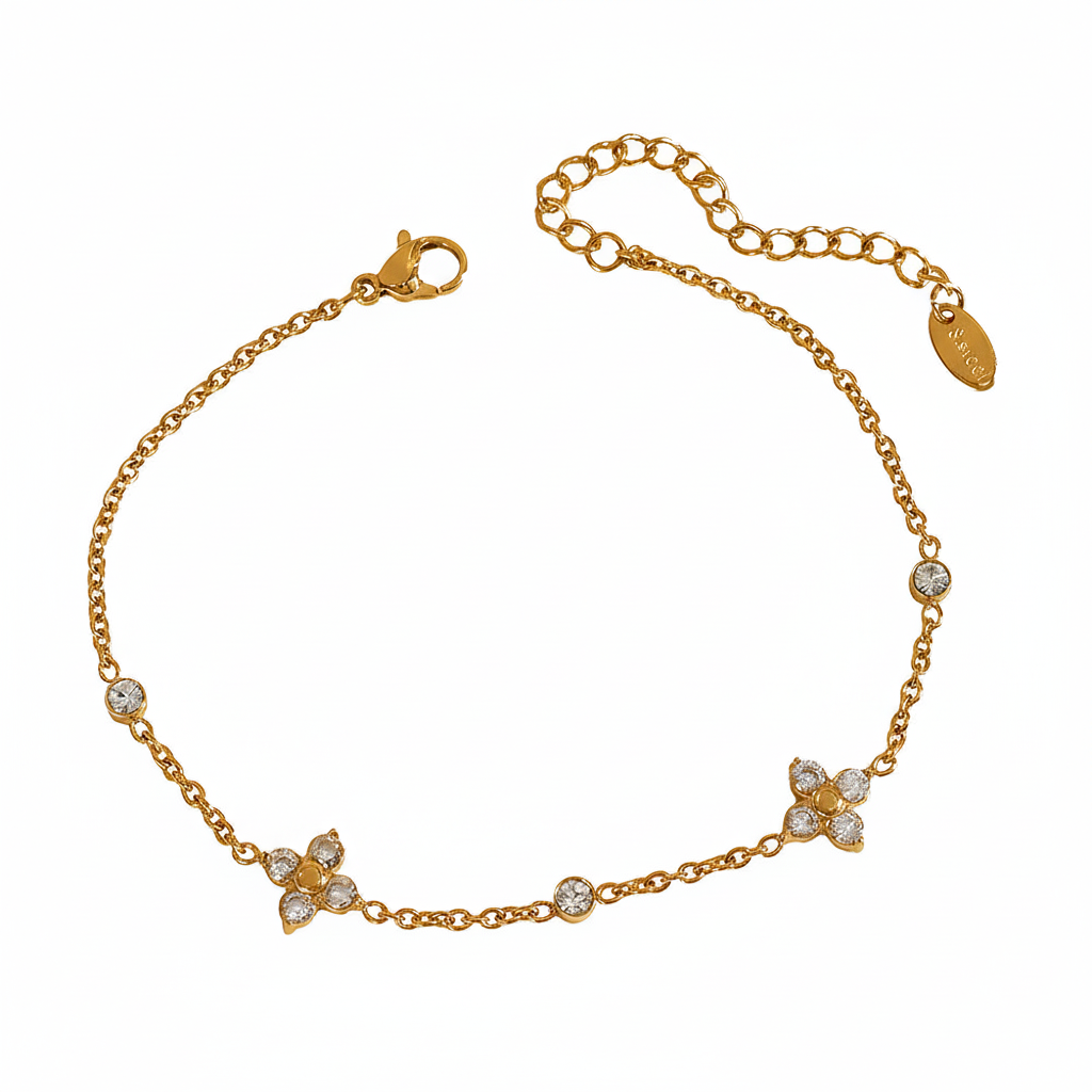 Feines 18K vergoldetes Edelstahl-Armband mit kleinen Blütenelementen und Zirkonia – wasserfest und nickelfrei.