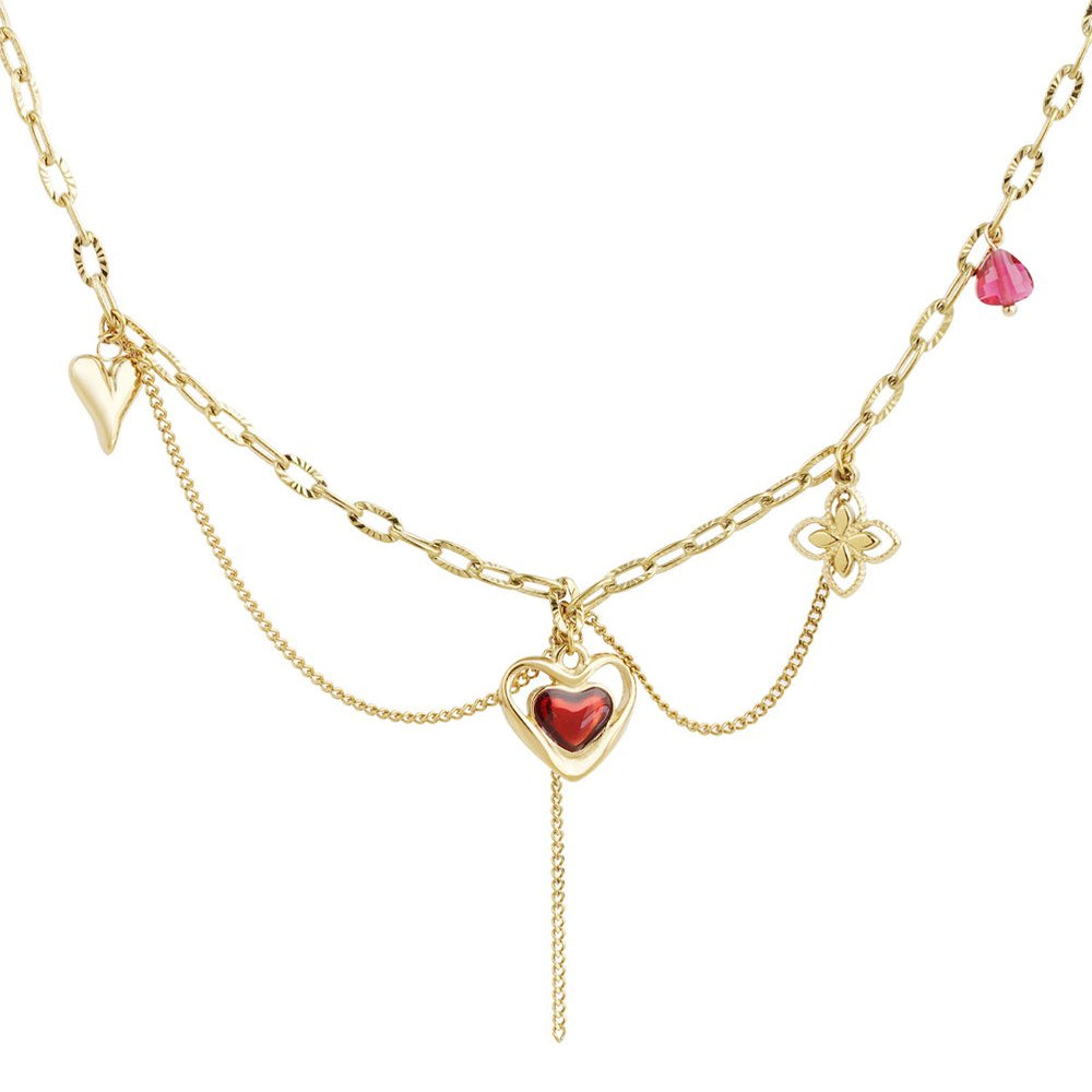 Edelstahl Armband mit vergoldeten Herzanhängern und funkelnden Zirkonia-Steinen – wasserfestes, nickelfreies Armband von Elariya Jewelry.